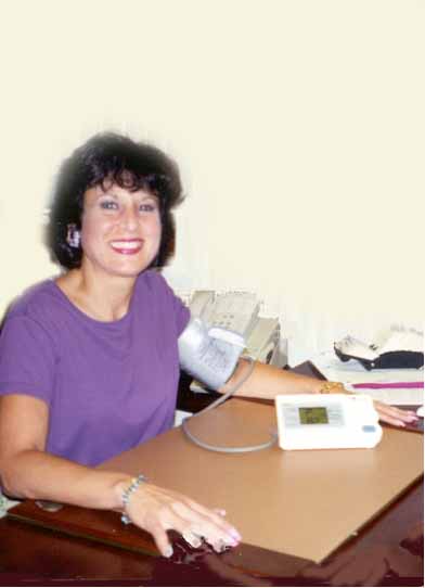 Cathy DiCostanzo takes her own blood pressure